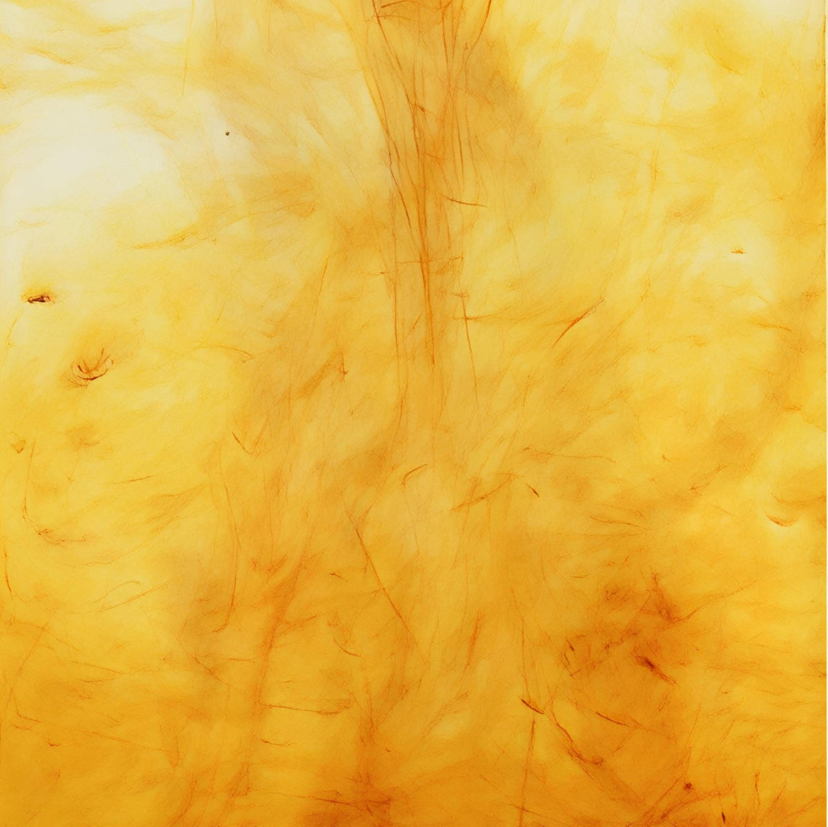 Abstract amber texture with warm, flowing light reflections.